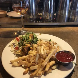 Salmon Taco (split) with turnip fries.