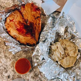 Kashmiri naan (stuffed w/ nuts, raisins, sweet cherries &amp; coconut) / $4.45 + Himalayan momo (chicken) / $8.95