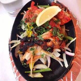 Tandoori Chicken brought to table