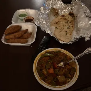 Pakodas (top left). Naan.  Tawa masala (bottom of photo)