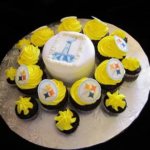 Super bowl chocolate cake with Super Bol logo edible image surronded with Chocolate cupcakes