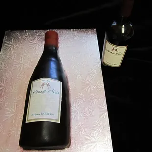 Chocolate airbrushed Wine Bottle cake with edible image label
