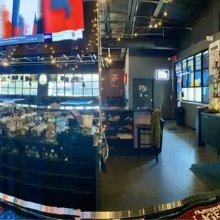 TVs, bar, pool tables, crack machines (video slots)