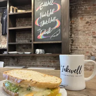 Broken yolk sandwich with avocado on sourdough and a dirty chai with oat milk - delicious!