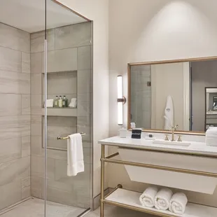 Each of our bathrooms offer plenty of space, light, and curated comforts.