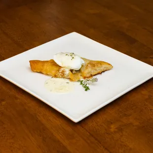 Prosciutto Twist with homemade puff pastry, prosciutto, egg, and lemon-thyme sauce