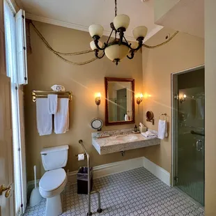 a bathroom with a chandelier