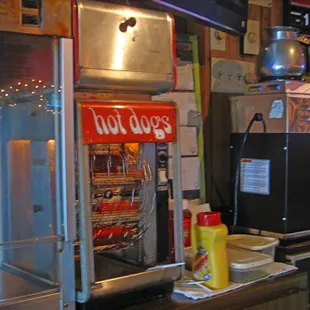 a hot dog stand with a hot dog in it