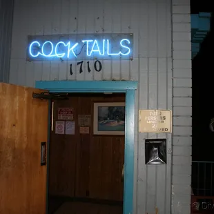 the entrance to a cocktail bar