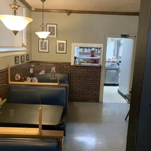 Booth, seating, and kitchen view