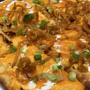 a pizza with onions and cheese