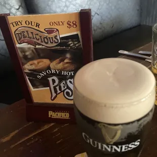 a pint of beer and a menu