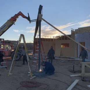 Jeremy welding the steel post to the base plate for this 50' structual beam