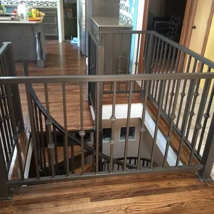 Powder coated railing to top off a spiral staircase! Simple but really nice design.