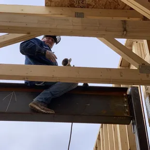 Jeremy finish welding on a few studs for the framers