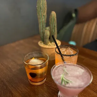 two cocktails on a wooden table