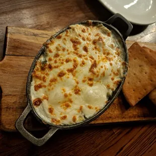 Spinach and artichoke dip. Super flavorful and pitas cooked just right to scoop up the dip.
