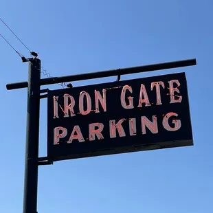 a sign for iron gate parking