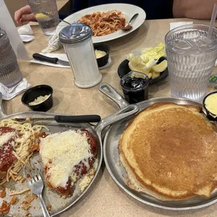 Pancakes from omelette dish; chicken parm; spaghetti with meatballs.