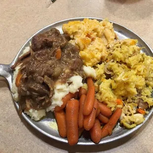 Pot roast over mashed potatoes, chicken and rice, and cheesy chicken noodle pasta