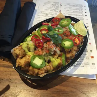 Cauliflower nachos. They r not bad but could use a little more flavor but I love that they're cauliflower!