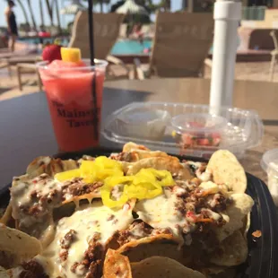 Loaded nachos and frozen lemonade poolside