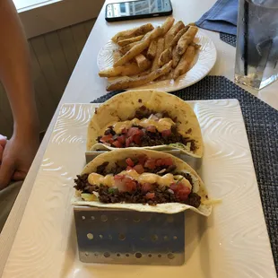 three tacos and french fries