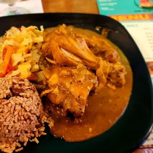 Curry chicken,  cabbage, rice and peas