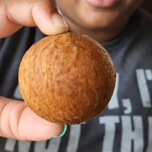 a person holding a nut