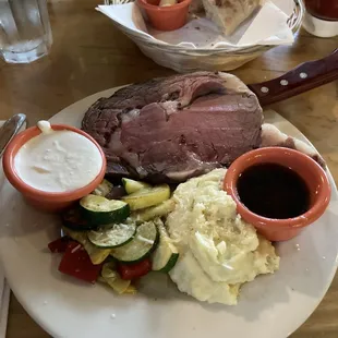 Famous prime rib. I requested it medium. Served with creamy horseradish sauce, au jus, roasted veggies and Parmesan mashed potatoes.