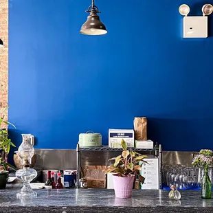 a kitchen counter with a blue wall