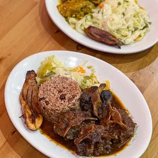 two plates of food on a wooden table