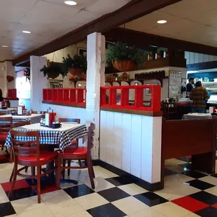 View of dining room area and kitchen.