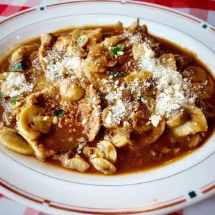 a pasta dish with meat and cheese