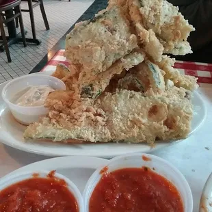 Leaning Tower of Zucchini! Huge portion, lightly-battered, mouth-watering! Served with a zesty horseradish sauce, plus marinara.