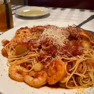  a plate of pasta and shrimp