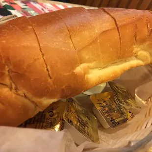 Fresh warm bread that comes with packets of salted sweet cream butter