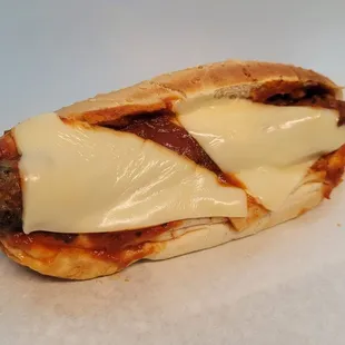 a meatball sandwich with cheese