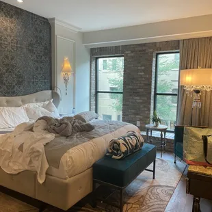 beautiful comfortable queen sized bed, two wool blankets, and nice large windows for a good amount of natural light.