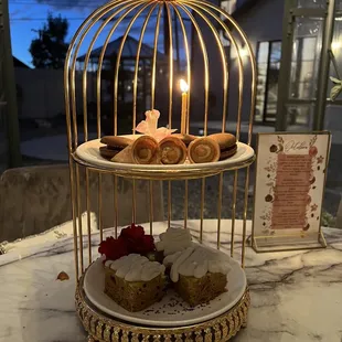 a birdcage filled with pastries