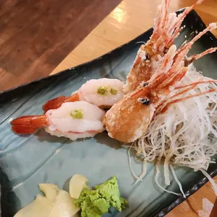 a plate of shrimp and noodles