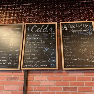 menus on a brick wall