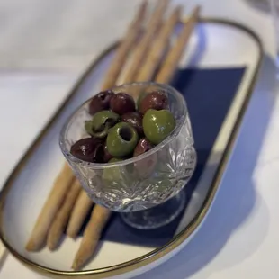 Complimentary olives and breadsticks , YUM