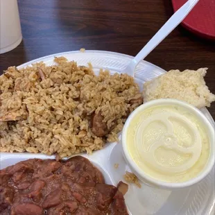 Jambalaya, potato salad and red beans and what is suppose to be a roll.