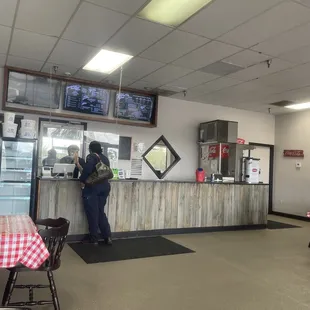 a woman standing at the counter