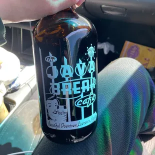 a person holding a beer bottle