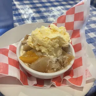Peach cobbler with, bluebell, vanilla ice cream.