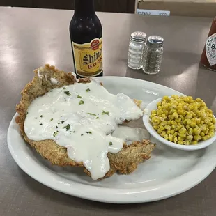 Chicken fried steak and seasoned corn