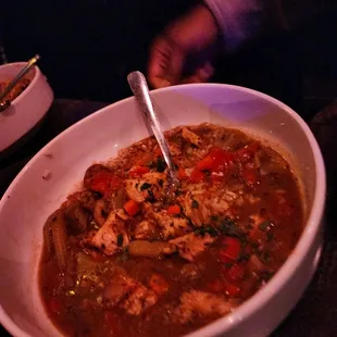 a bowl of soup with a spoon in it