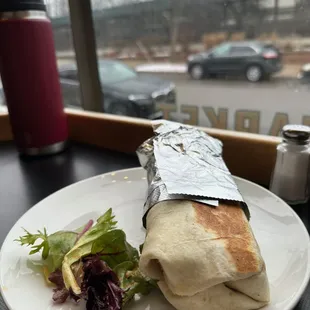 Breakfast Burrito - Grilled flour tortilla filled with scrambled Grazing Fields eggs, jack cheese, black beans with onions and pepper.